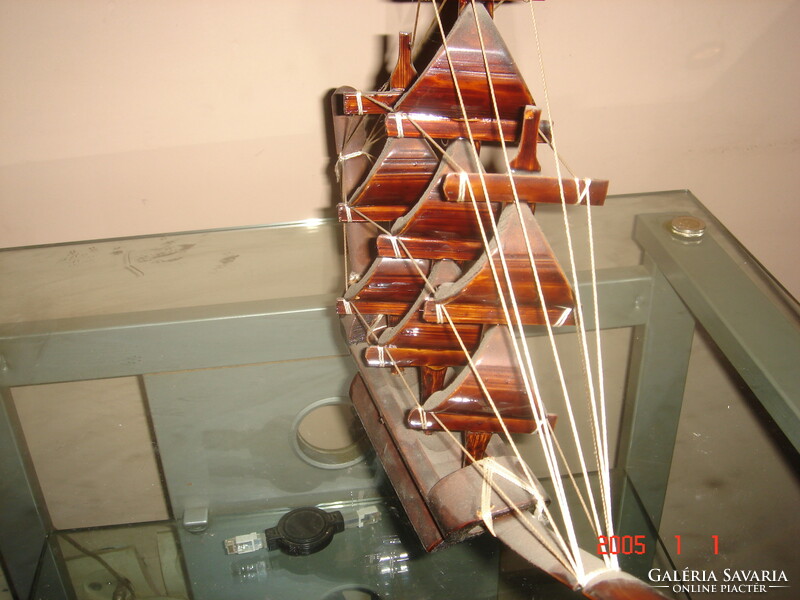 Carved wooden sailboat