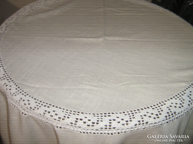 Wonderful round tablecloth with hand-crocheted edges and inserts