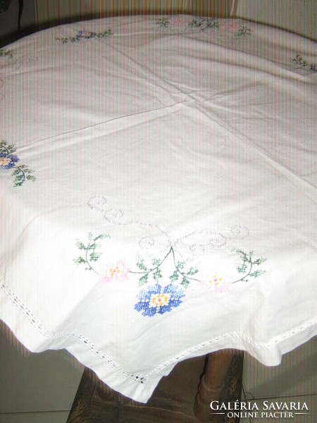 Beautiful small cross-stitched floral tablecloth