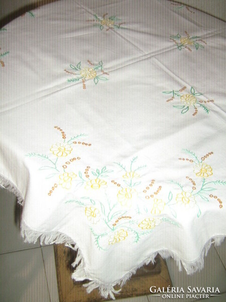 Beautiful yellow floral hand embroidered fringed tablecloth
