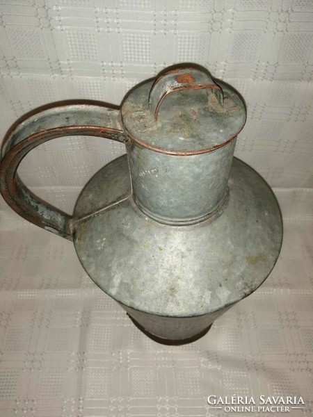 Old tin water jug