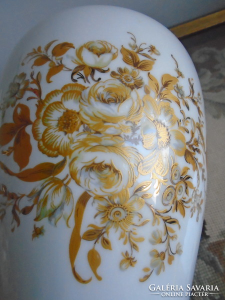 Urn vase with rich gold decor.