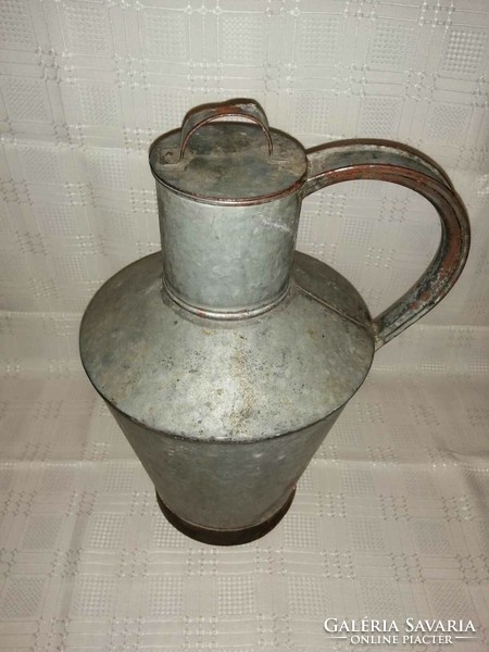 Old tin water jug