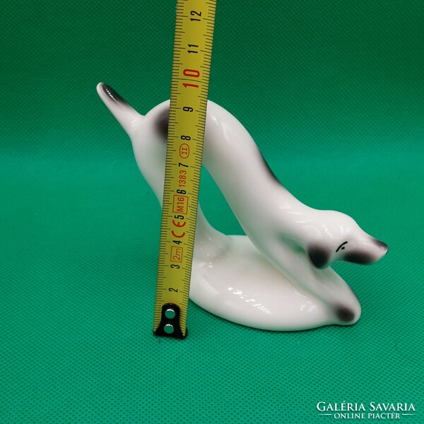 Stretching porcelain dog figure in art deco style