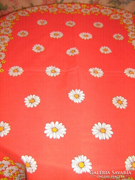 Beautiful vintage floral spring tablecloth on a red background