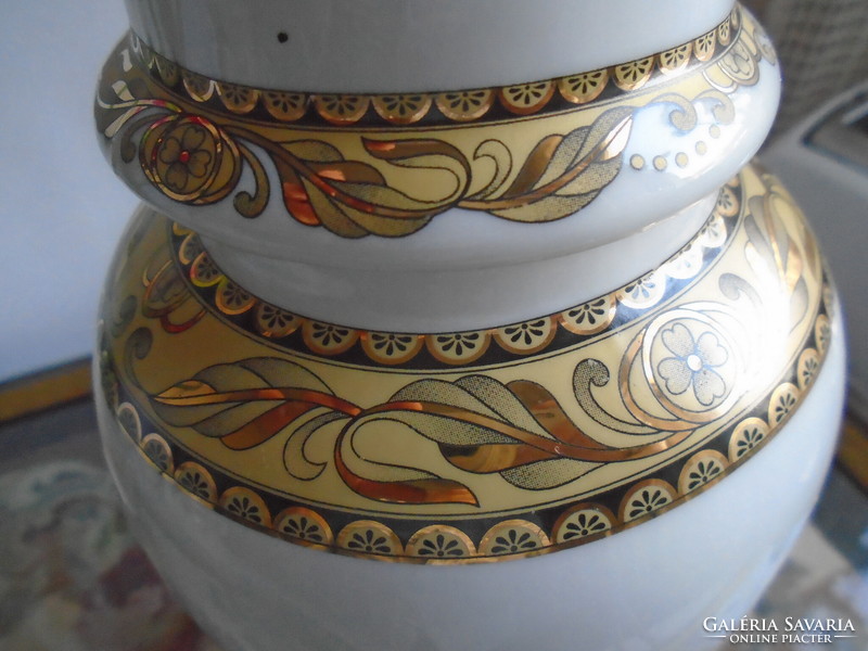 Urn vase with rich gold decor.