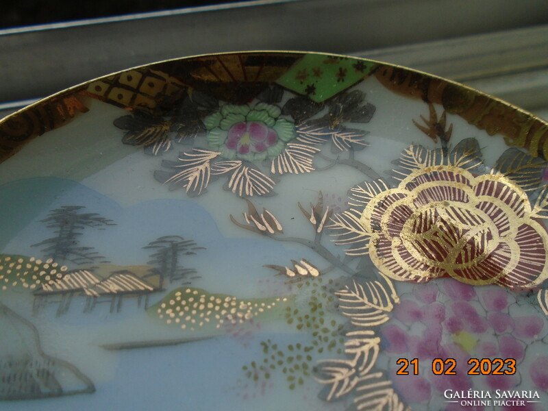 Antique hand-painted, gold-contoured eggshell porcelain Japanese bowl with a pair of birds and a flower pattern