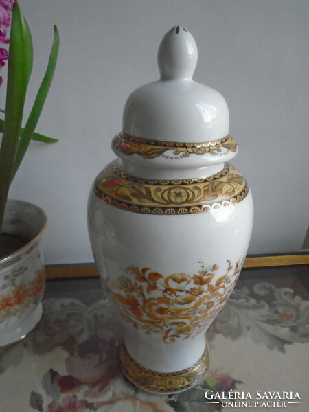 Urn vase with rich gold decor.