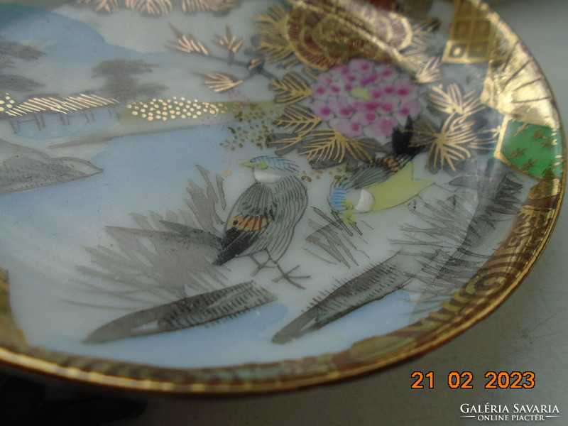 Antique hand-painted, gold-contoured eggshell porcelain Japanese bowl with a pair of birds and a flower pattern