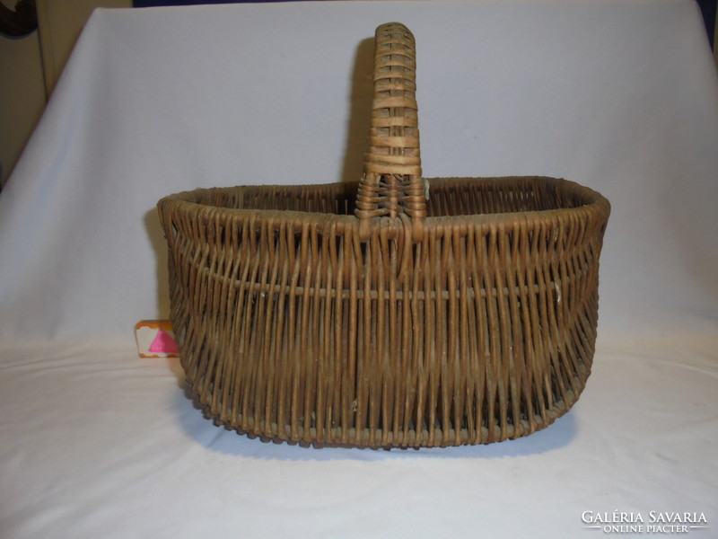 Old cane wicker market basket, rake - piece of nostalgia