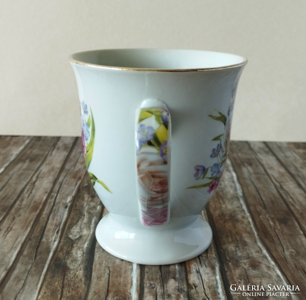 A porcelain tea set with a beautiful bouquet of roses