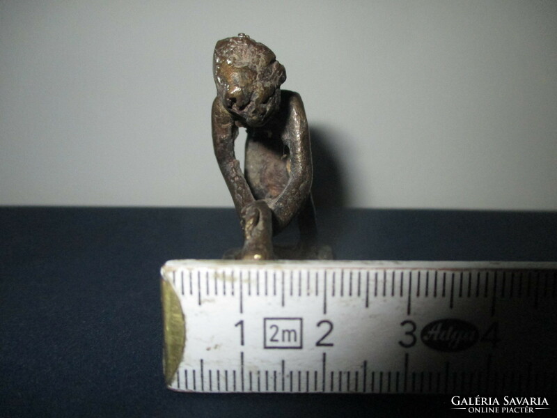 A small amorphous bronze statue