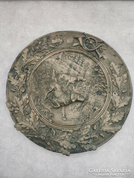 Bronze plate with a hunting scene