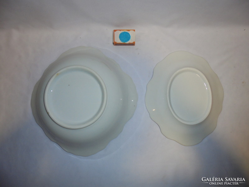 Two old, snow-white bowls with convex patterns - together