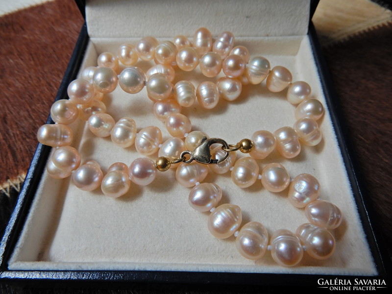 A string of cultured freshwater pearls with a gold-plated silver clasp