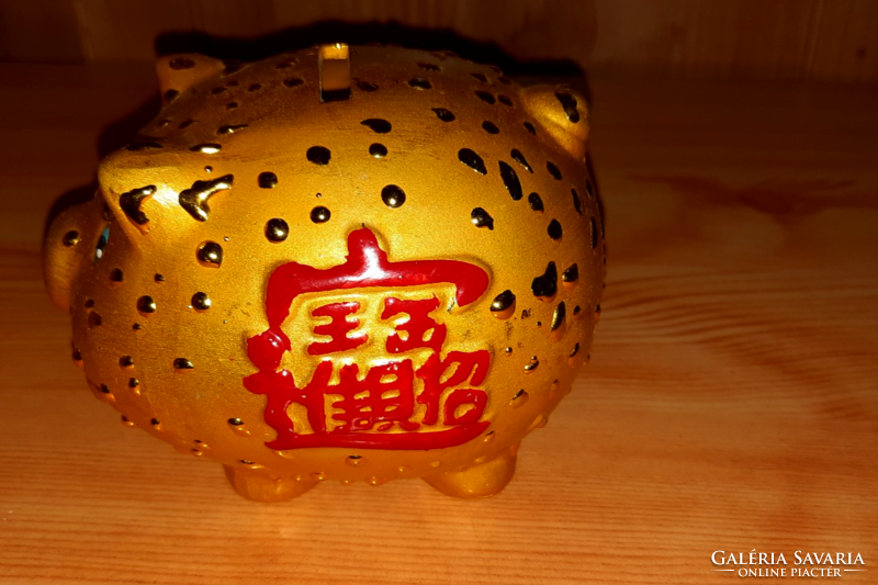 Ceramic gold colored piggy bank