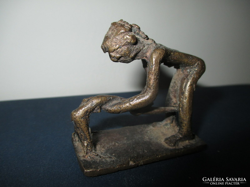 A small amorphous bronze statue