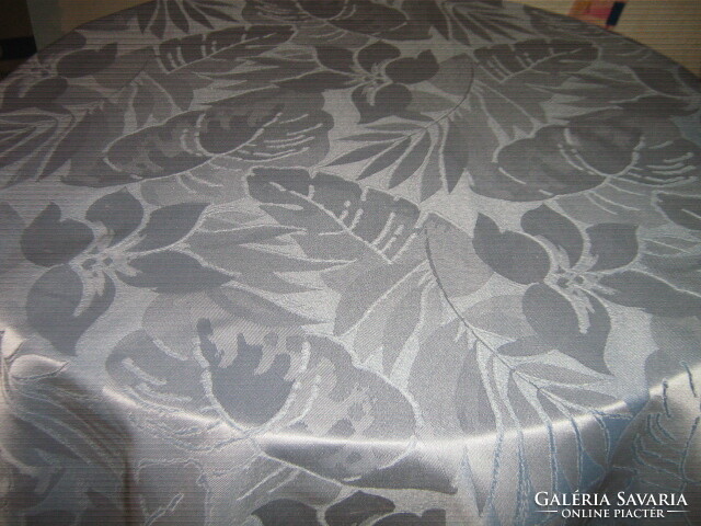 Elegant woven tablecloth with a beautiful blue leaf pattern