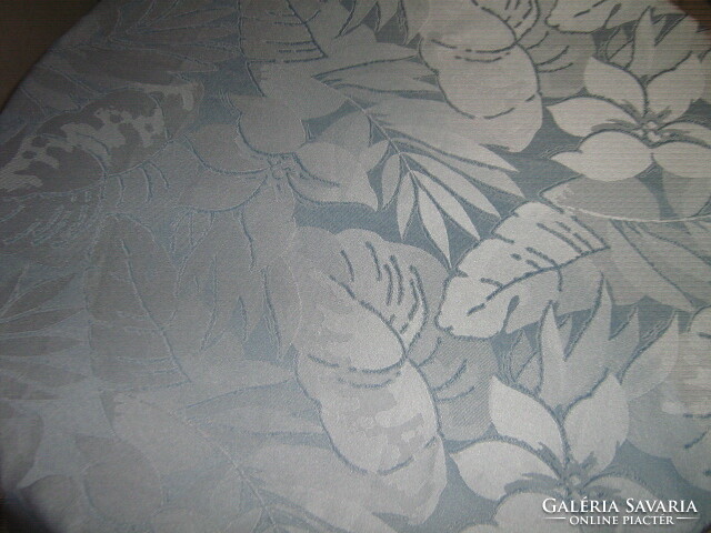 Elegant woven tablecloth with a beautiful blue leaf pattern