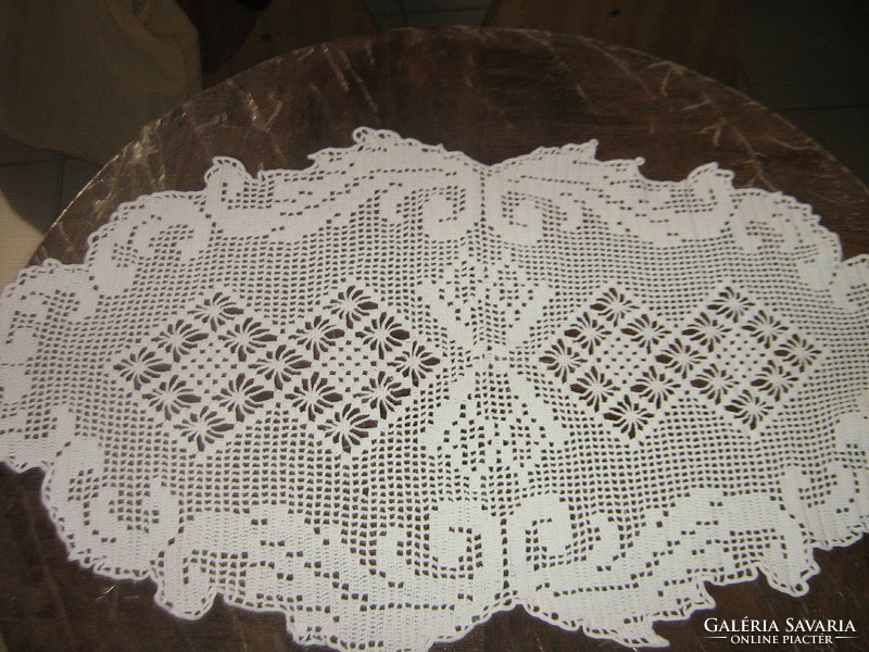 Beautiful crocheted white oval tablecloth