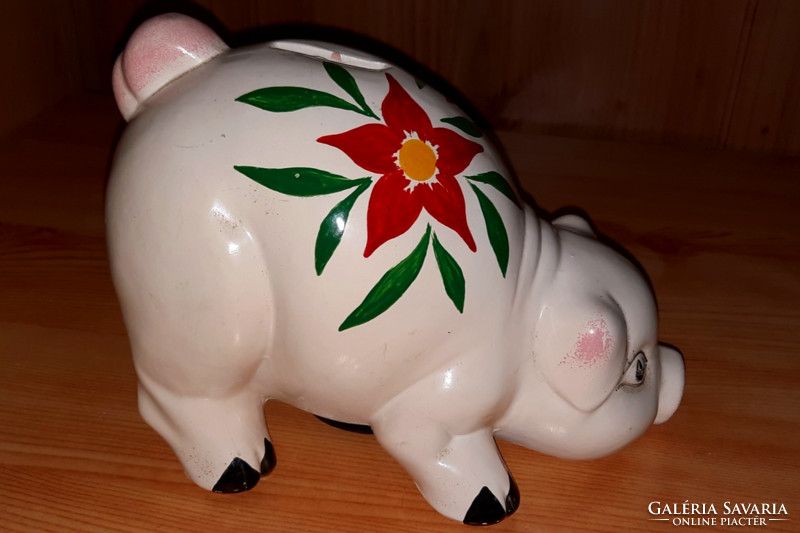 Old ceramic piggy bank with flower pattern