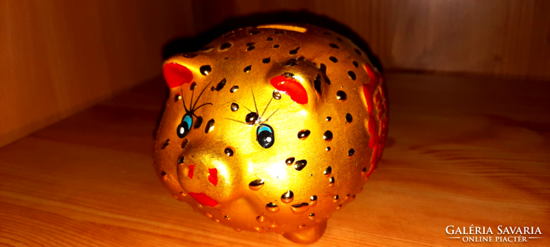 Ceramic gold colored piggy bank