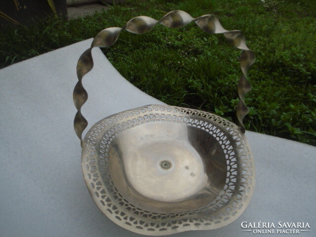 A three-legged openwork rim metal serving center basket is a rarity