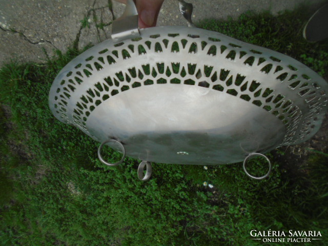 A three-legged openwork rim metal serving center basket is a rarity