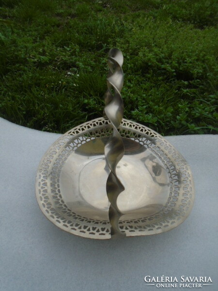 A three-legged openwork rim metal serving center basket is a rarity