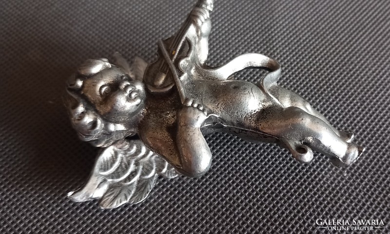 Metal putto, angel face, difficult to negotiate, art deco design