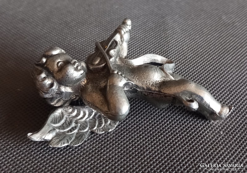 Metal putto, angel face, difficult to negotiate, art deco design