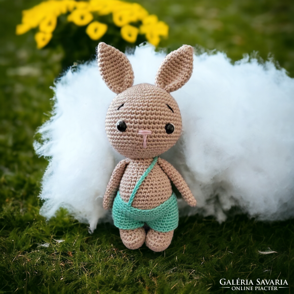 A potty bunny crocheted by hand using the amigurumi technique