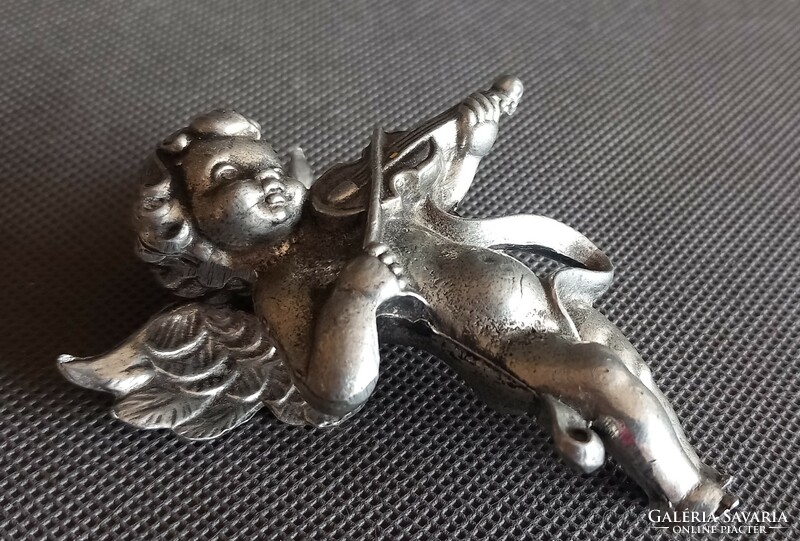 Metal putto, angel face, difficult to negotiate, art deco design