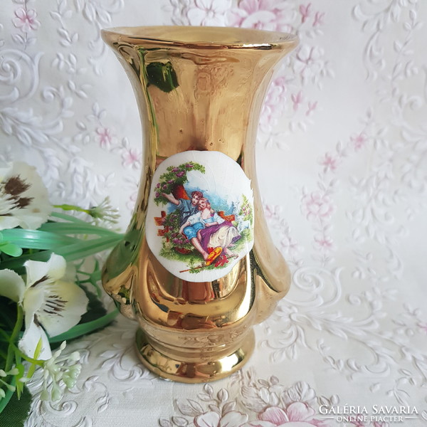 New, golden, ceramic vase depicting a couple in love