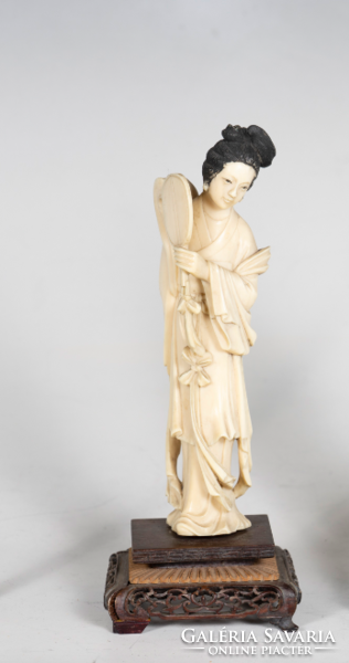 Carved bone female figure