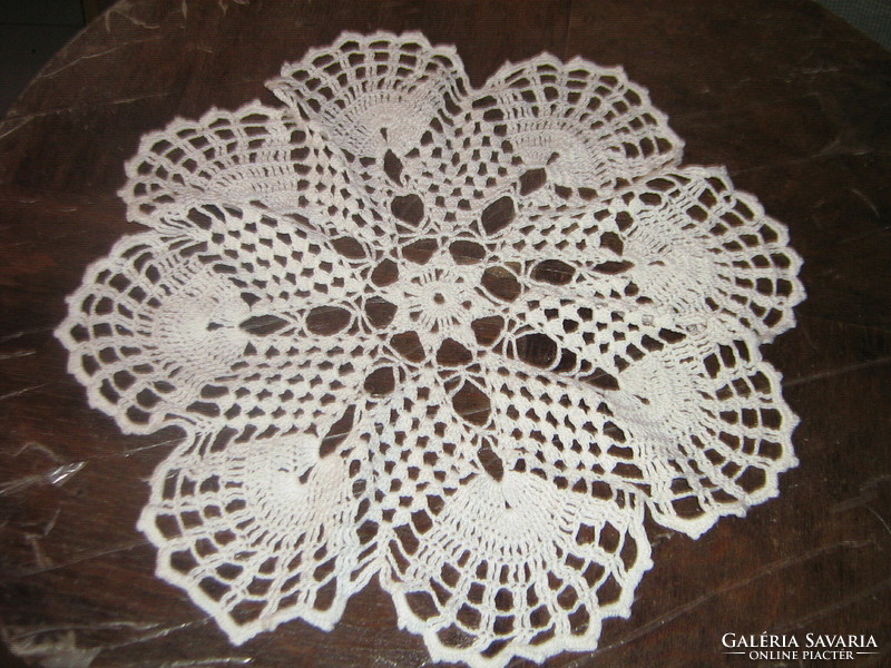 Beautiful white hand-crocheted round lace tablecloth