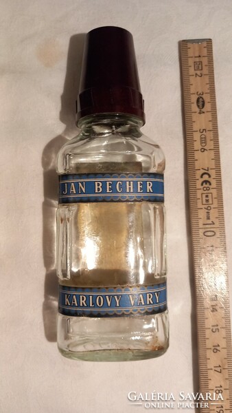 Small becherovka bottle with an old vinyl cap