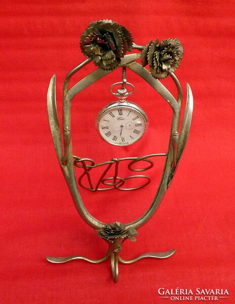 Art Nouveau pocket watch holder. Material is metal