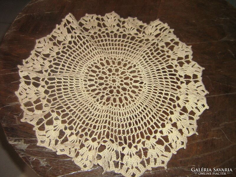 Beautiful beige hand-crocheted round lace tablecloth