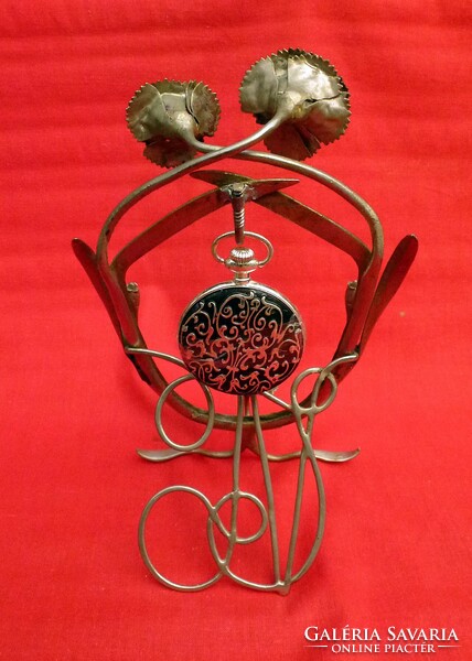 Art Nouveau pocket watch holder. Material is metal