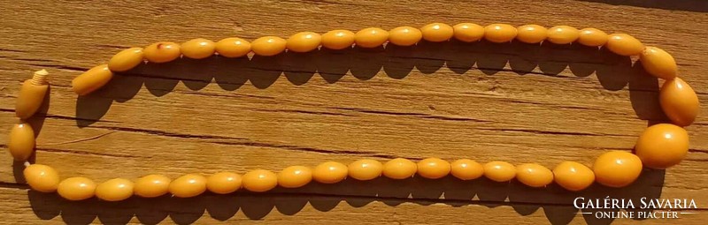 Amber colored plastic necklace