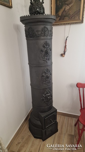 Cast iron column stove. 170 cm high