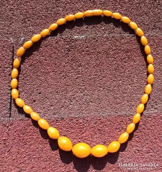 Amber colored plastic necklace