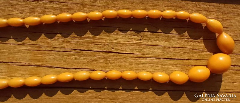 Amber colored plastic necklace