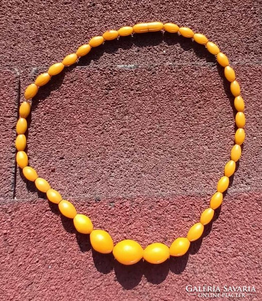 Amber colored plastic necklace