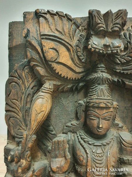 Indian carved wood with Hindu religious motifs.