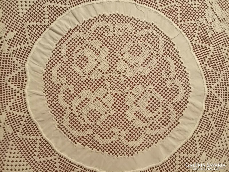 Old pink, round lace tablecloth