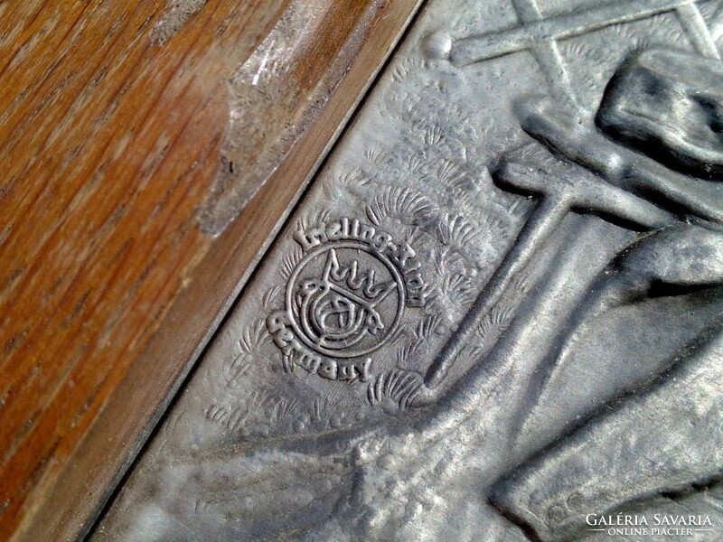 Embossed framed tin plaque with amusing Bavarian lad, a unique rarity