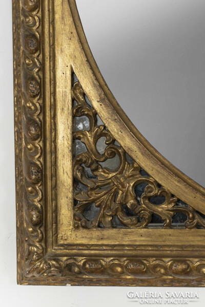 Gilded wood framed mirror with openwork decor