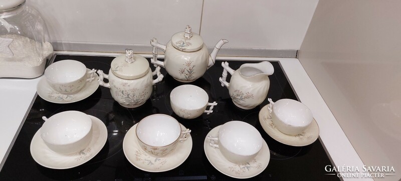 Antique earthenware coffee set with embossed pattern